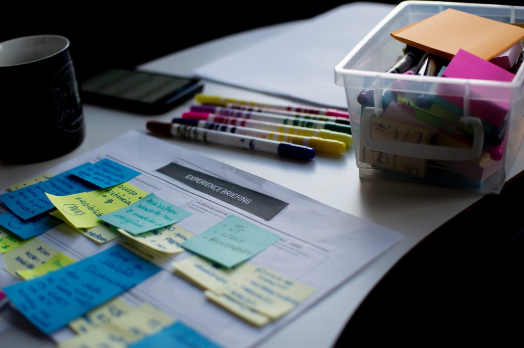 desk of a digital marketer with pencils and sticky notes