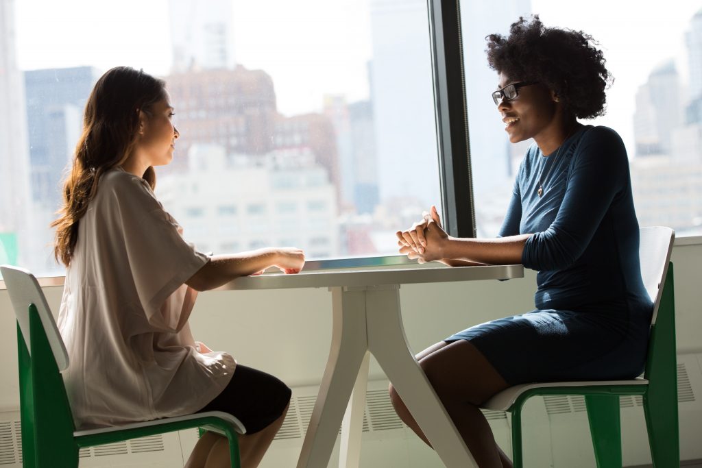 two women discussing ppc service