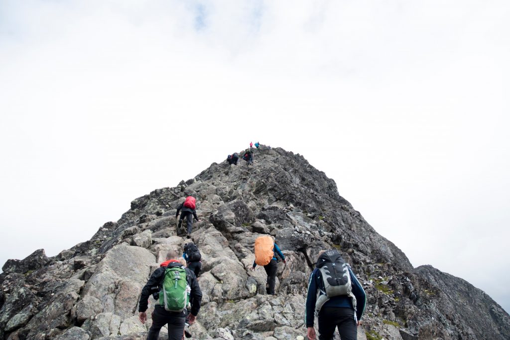 people climbing a mountain