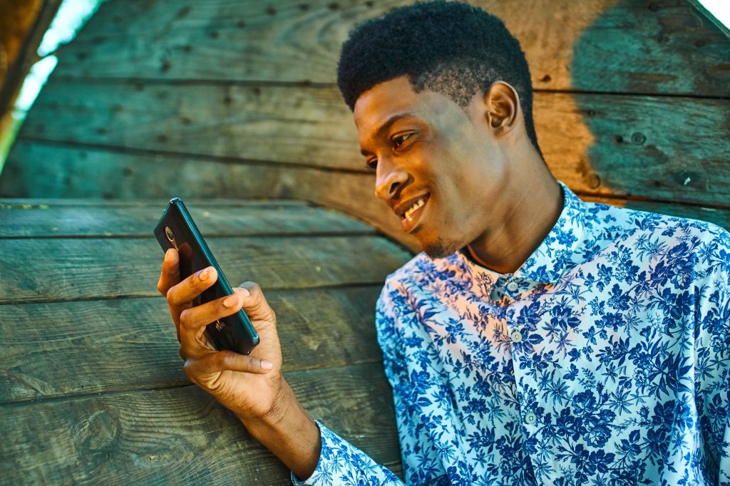 man looking at smartphone