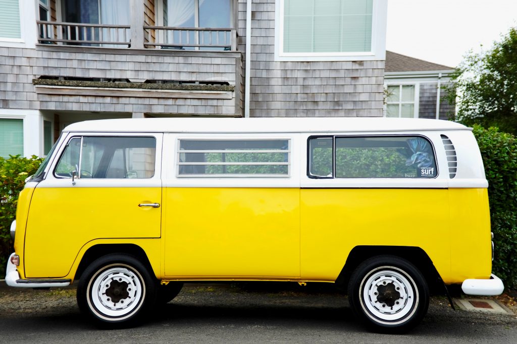 yellow van parked on a side street