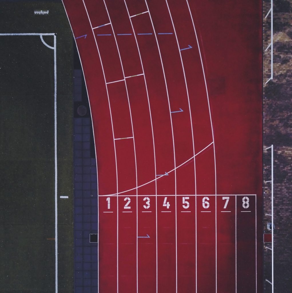 red outdoor running track aerial view