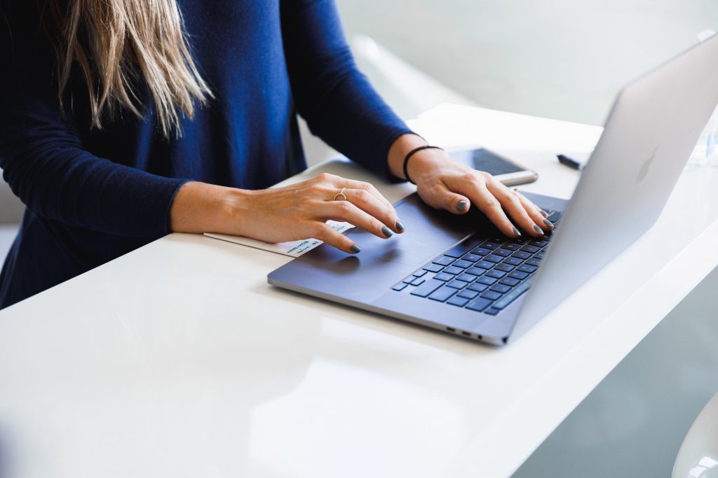 woman typing on computer