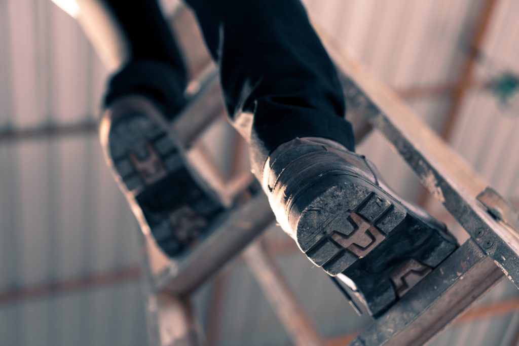 Boots climbing up a ladder 