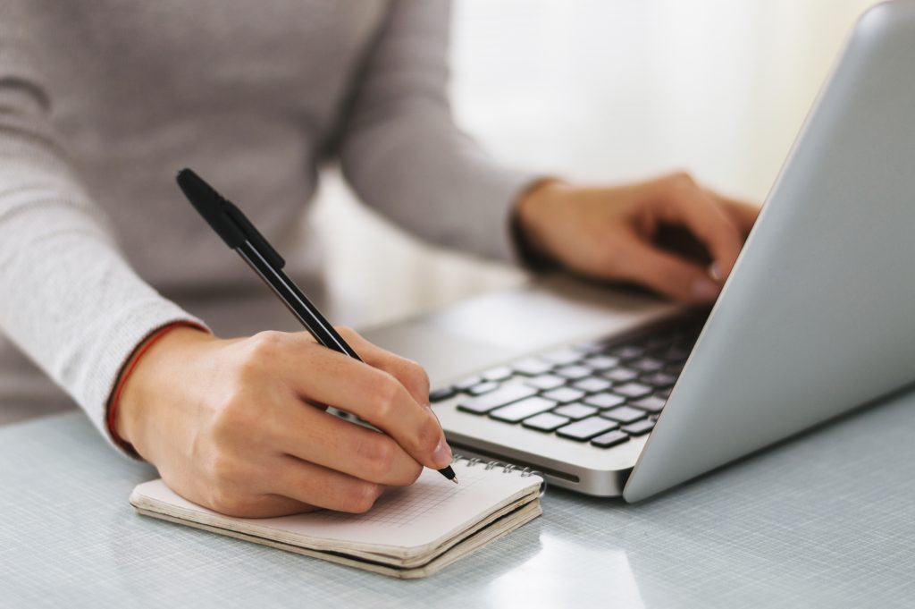 hand working with new modern computer and writing