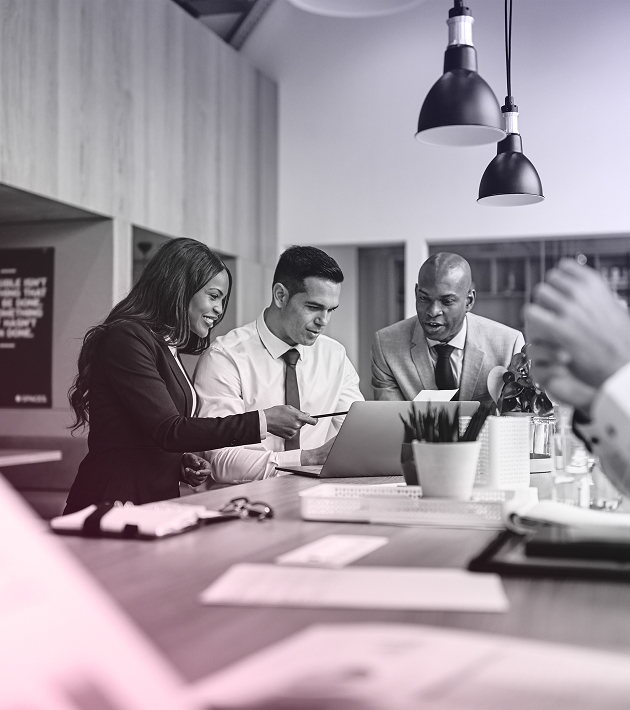 Marketing Consultants around a Computer